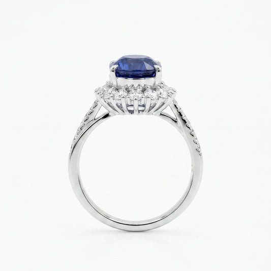 Royal blue sapphire diamond halo ring close-up — oval cut platinum twist band | Tayam Jewellery Sydney