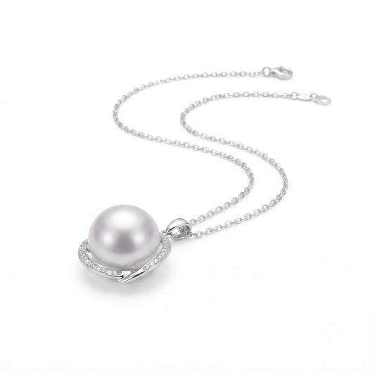 AAA lustre South Sea Pearl pendant showing pink overtone and diamond detail in 18K white gold