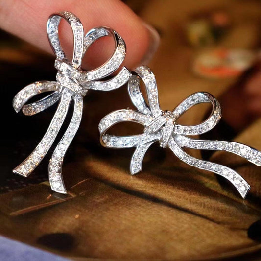 Sparkling bow-shaped diamond earrings, elegant Sydney jewellery for love and celebration