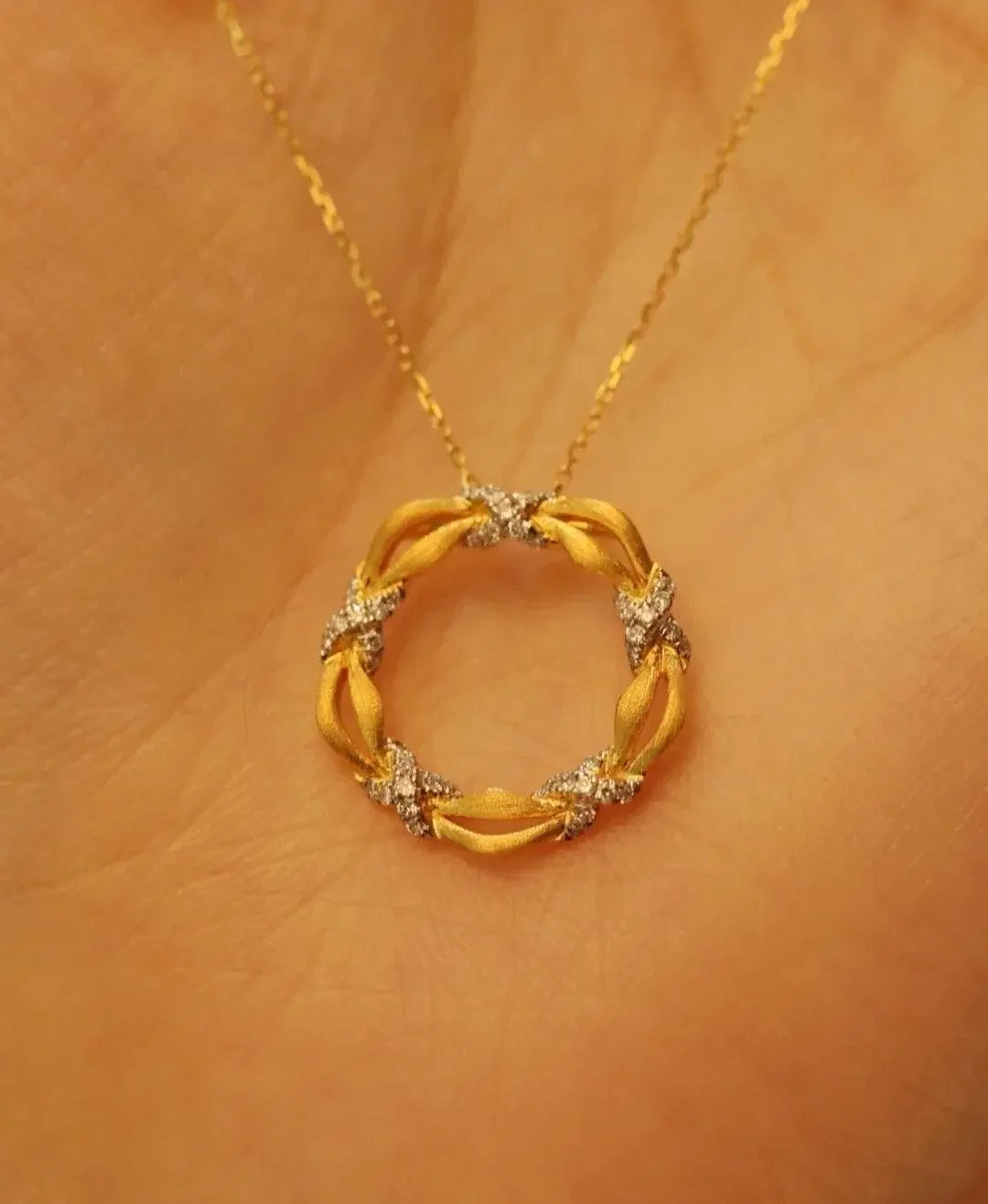 Elegant gold circle pendant necklace with diamond accents, worn on skin, Sydney jewellery