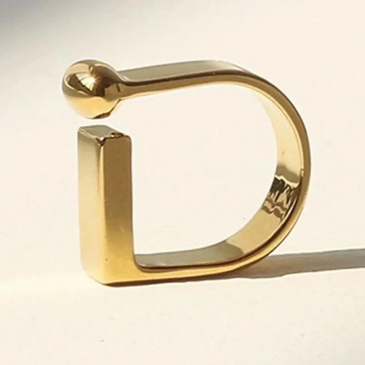 Gold initial D ring with modern design, sleek polished finish, minimalist letter jewelry