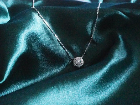 Elegant diamond pendant necklace on dark teal satin, perfect for Sydney jewellery lovers
