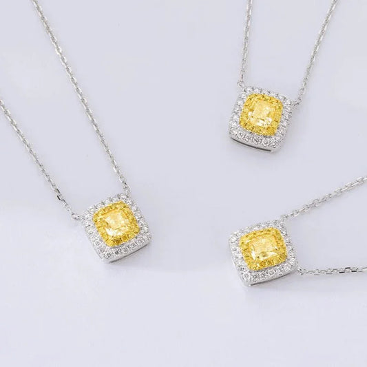Elegant yellow diamond pendants with diamond halos on silver chains, perfect for luxury Sydney jewellery lovers.