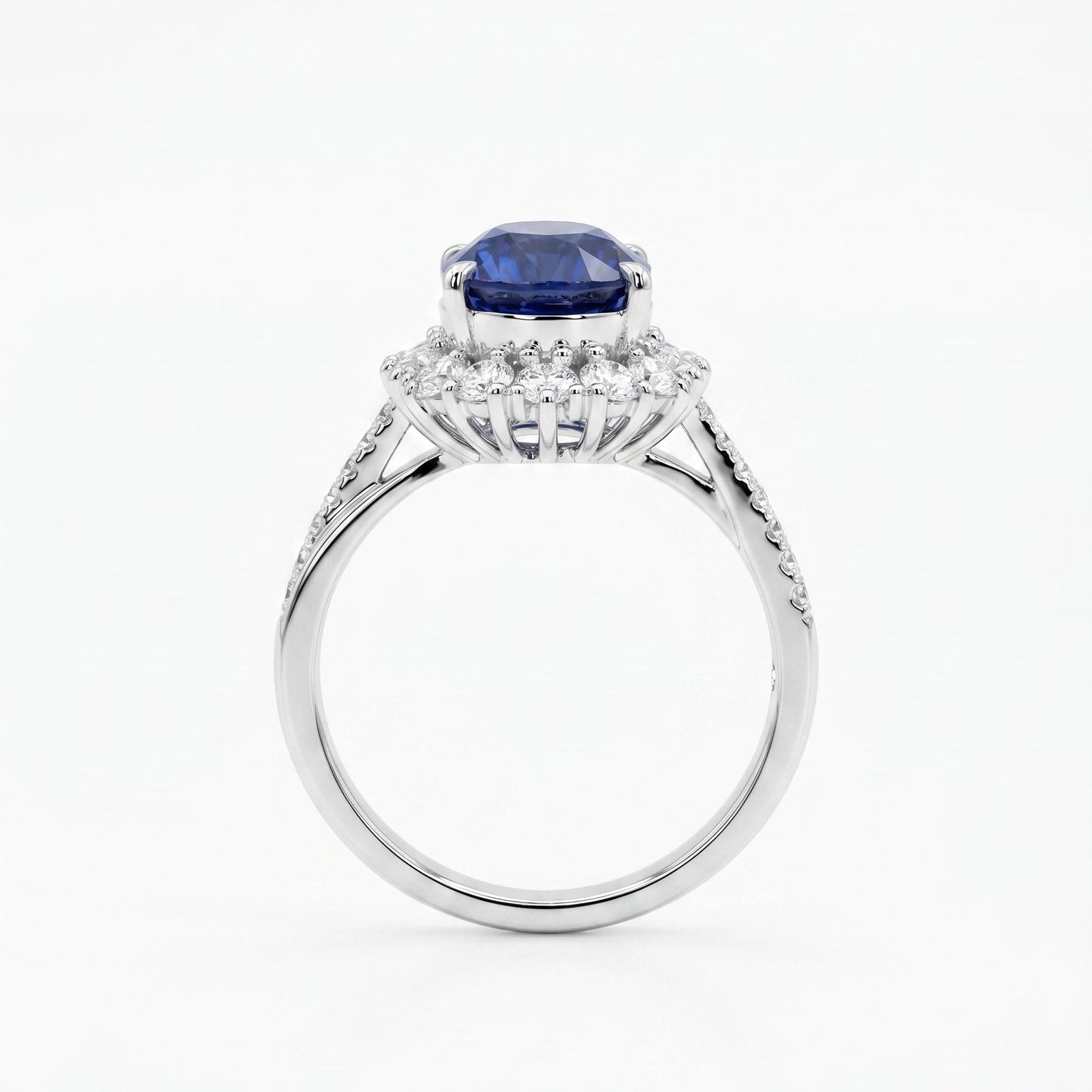 Royal blue sapphire diamond halo ring close-up — oval cut platinum twist band | Tayam Jewellery Sydney