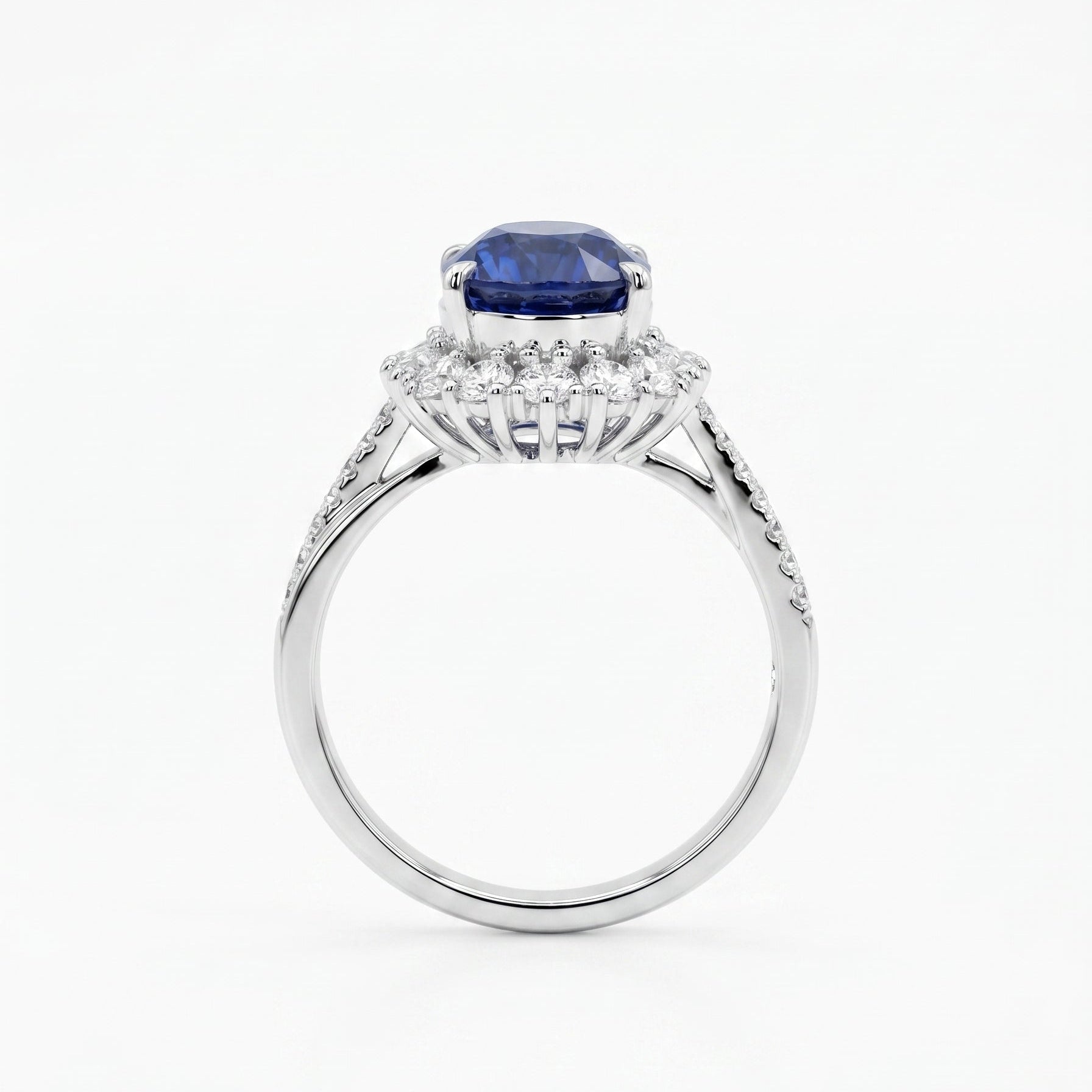 Royal blue sapphire diamond halo ring close-up — oval cut platinum twist band | Tayam Jewellery Sydney