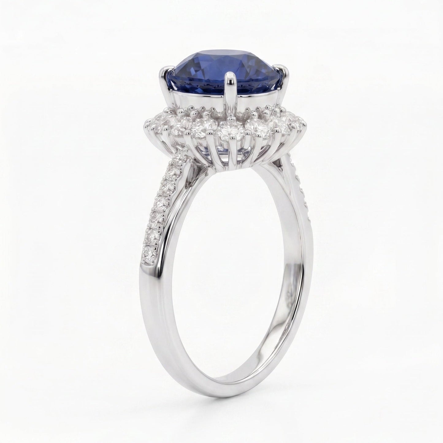 Royal blue sapphire ring side profile — diamond halo platinum Diana-inspired design | Tayam Sydney CBD