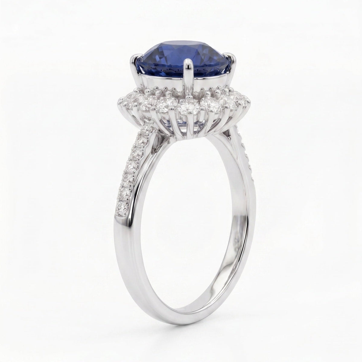 Royal blue sapphire ring side profile — diamond halo platinum Diana-inspired design | Tayam Sydney CBD