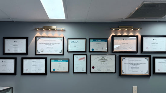 Framed certificates on a gray wall in an office setting