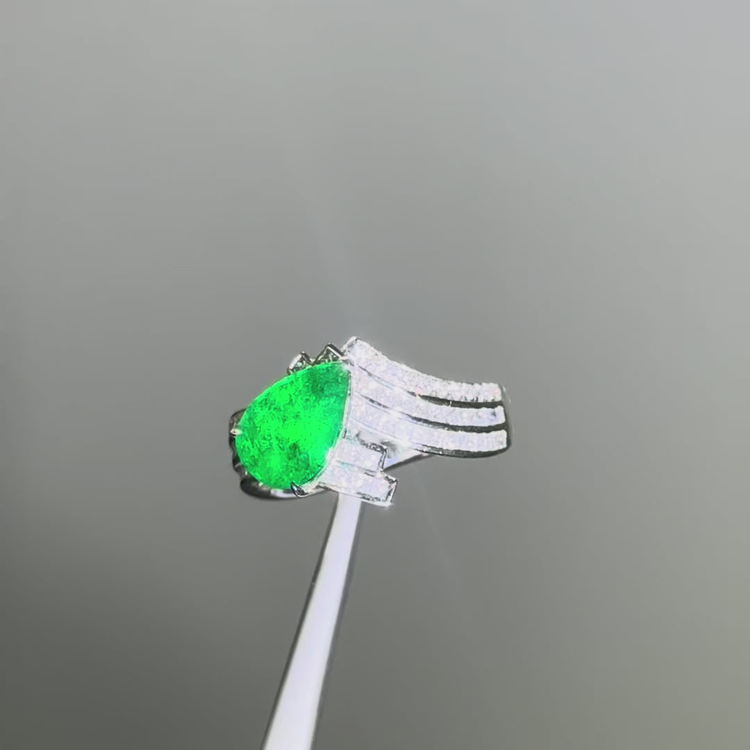 Exquisite pear-cut emerald and diamond engagement ring set in platinum, handcrafted by Tayam Jewellery in Sydney CBD