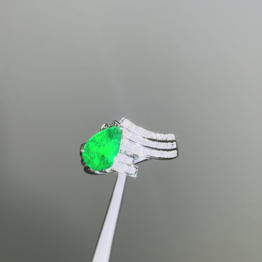 Exquisite pear-cut emerald and diamond engagement ring set in platinum, handcrafted by Tayam Jewellery in Sydney CBD