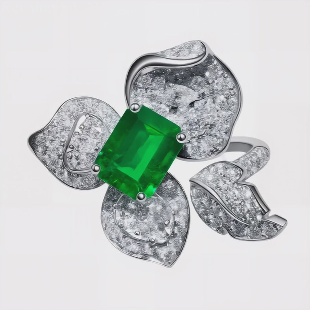 High-resolution video of 1.58ct emerald center stone ring with diamond flower petals set in 18K white gold, luxury jewellery crafted in Sydney.