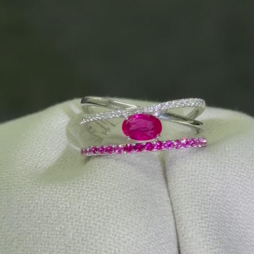 Pink ruby and diamond crossover ring in 9K white gold, 360 rotating view