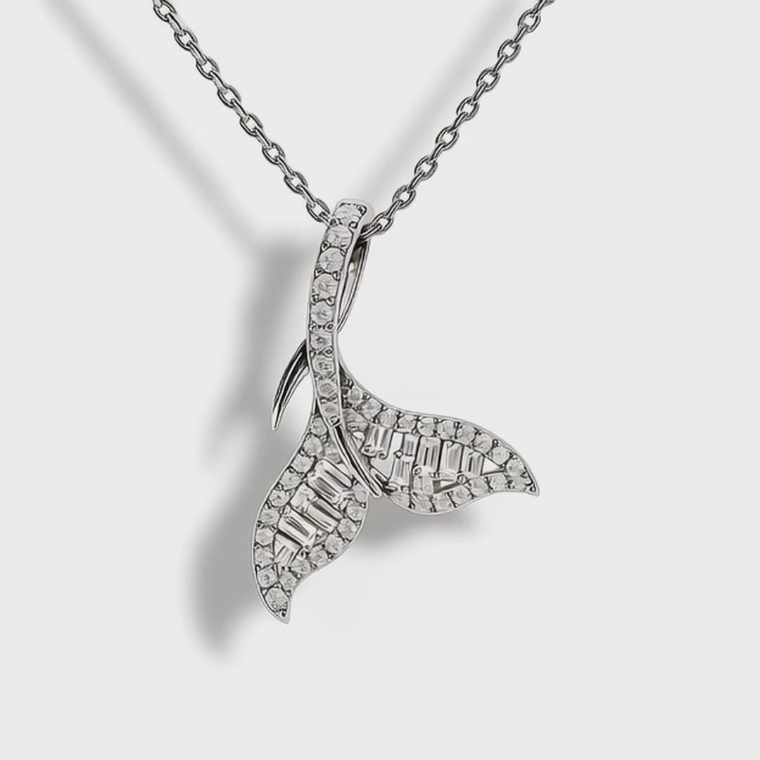 Close-up video of Mermaid Tail Pendant, 45mm design with 26.8pt natural diamonds sparkling under studio light