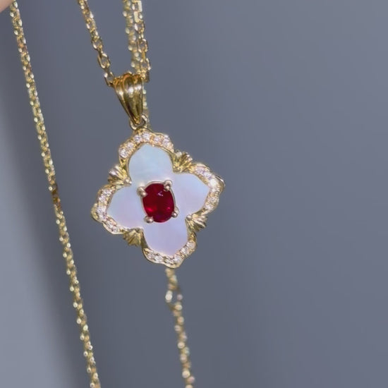 Ruby and mother-of-pearl quatrefoil pendant in 18K yellow gold, 360 rotating view