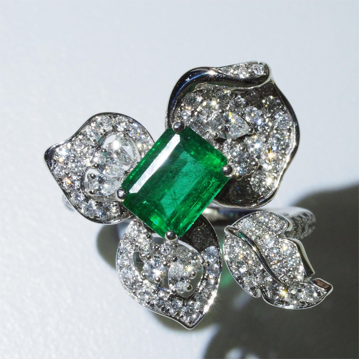 1.58ct Zambian vivid green emerald flower ring in 18K white gold — four sculpted diamond petals | Tayam Sydney CBD
