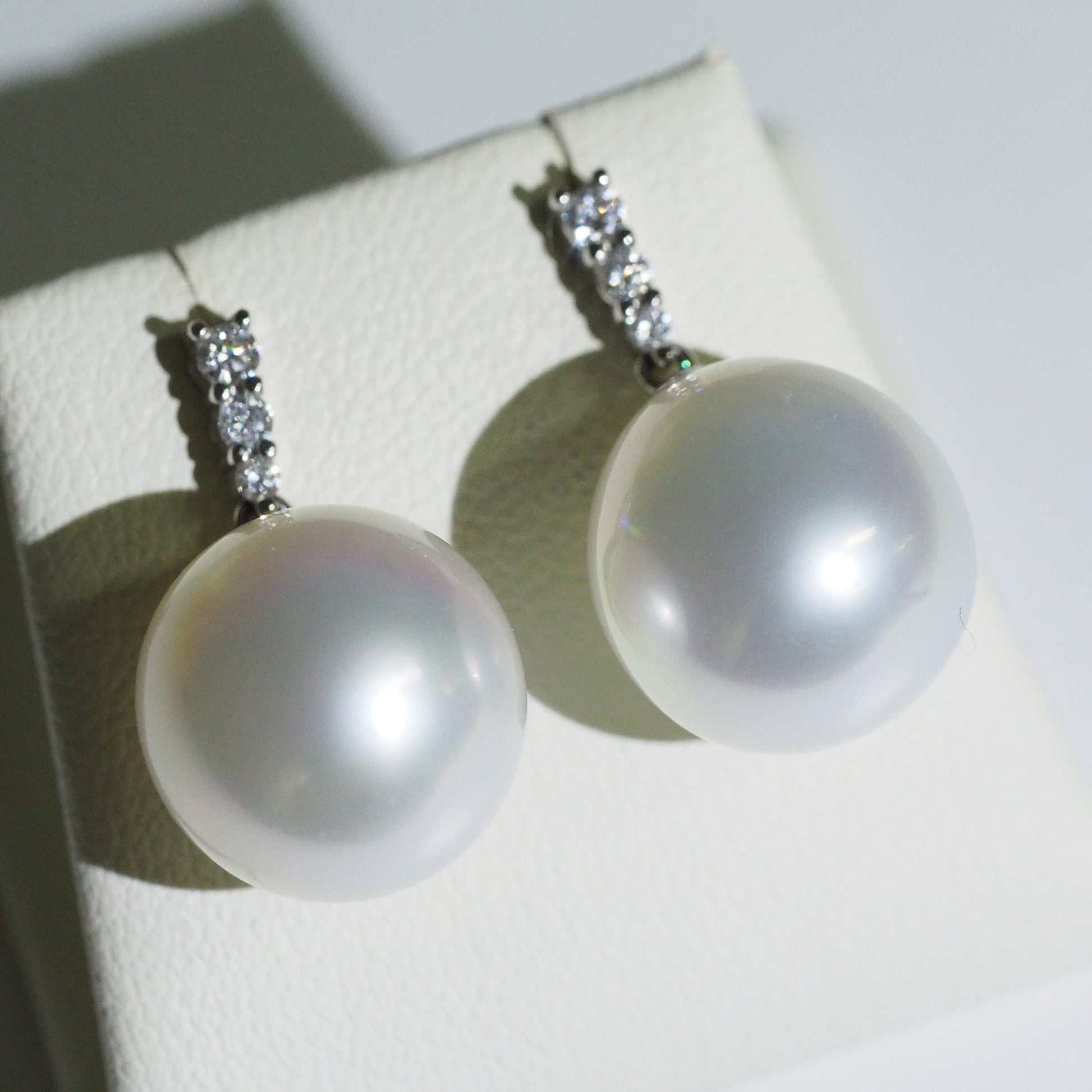 South Sea pearl drop earrings close-up — pink blue overtones AAA lustre 9K white gold | Tayam Jewellery Sydney