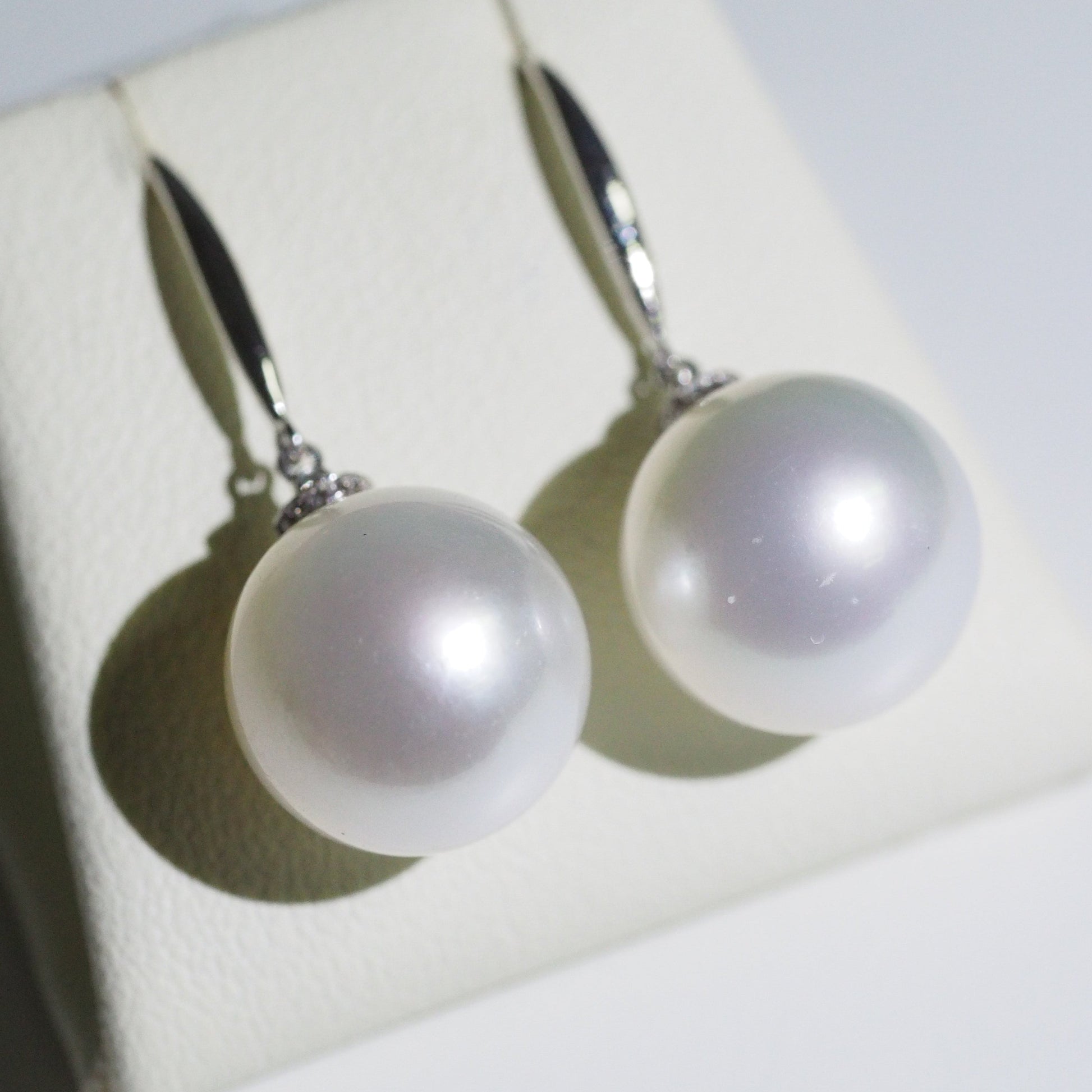 South Sea pearl drop earrings close-up — round pearl AAA lustre 18K white gold | Tayam Jewellery Sydney