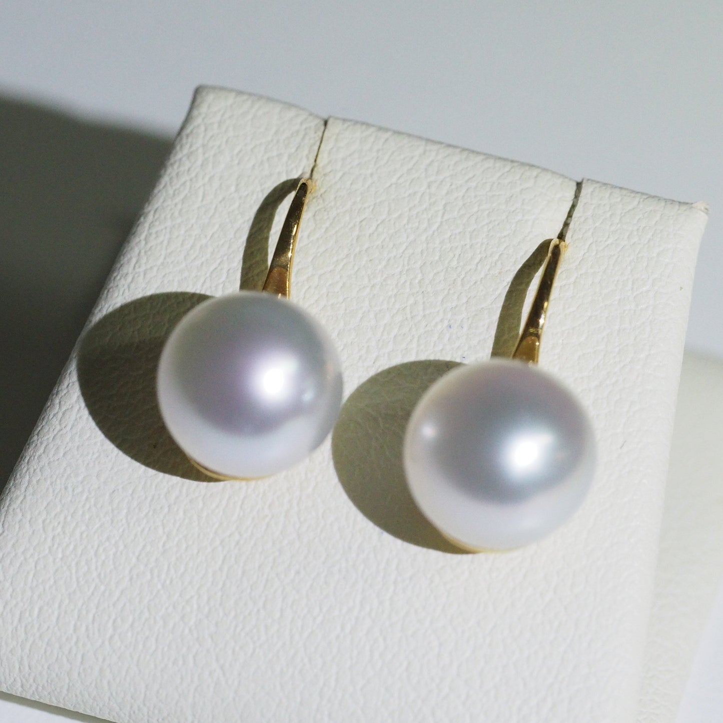 South Sea pearl earrings close-up — pink blue overtones AAA lustre 18K yellow gold | Tayam Jewellery Sydney