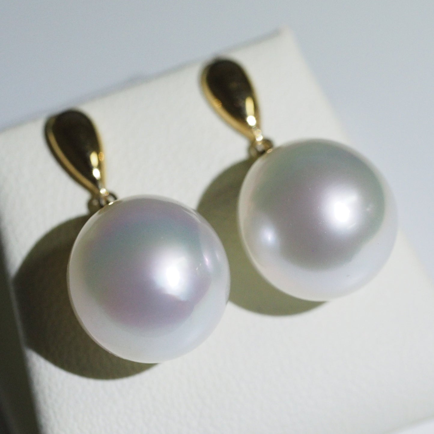 South Sea pearl earrings close-up — pink green overtones AAA lustre 18K yellow gold | Tayam Jewellery Sydney