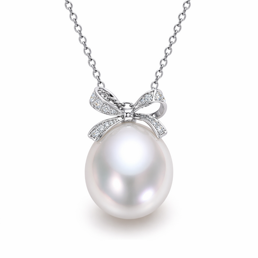 South Sea pearl pendant with diamond bow — platinum oval pearl pink overtones | Tayam Sydney CBD